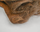 Natural dried palm net fabric showing coarse brown fibers in bulk wholesale quantity.