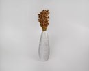 Natural dried pineapple button flowers in a tall white ceramic vase, bulk bouquet.