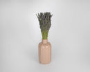 Bulk dried natural lavender bunches with deep blue flower buds in a beige ceramic vase.