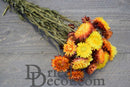 Bulk dried strawflowers bouquet in sunset hues with natural, sturdy stems on gray surface.