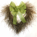 A 20-inch wide wreath made of twigs with a green burlap bow.