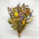 A dried floral bouquet featuring a variety of flowers and greenery, arranged 20 inches tall and 15 inches wide, bound with string.