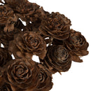 Close-up of bulk dried natural cedar rose bunches with textured brown pine cone petals.