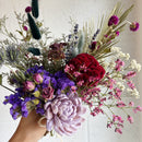 Medium dried flower arrangement with natural purple, red, and pink blooms in bulk wholesale style.