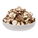 A white bowl filled with dried apple slices.