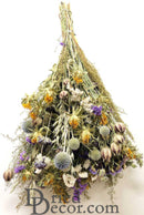 A dried flower bouquet with a variety of flowers and greenery, predominantly in blue shades, arranged in a bunch.