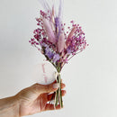 Small bundle of natural dried flowers in purple and lavender tones with pink accents, wholesale bulk arrangement.