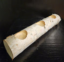 A white birch yule log holder with pre-drilled holes for tealight candles.