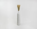 Bulk natural dried rye stalk bundles in light green to blond shades arranged in tall white vase.