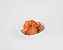 White bowl filled with natural dried quince slices showcasing orange and brown tones for bulk wholesale sale.