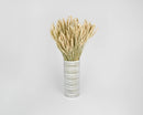 Natural dried beardless wheat bundles arranged in a striped white vase for wholesale bulk decor.