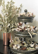Bulk dried natural Integrifolia leaves in light green, arranged in copper vase and metal tiered tray.
