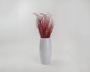Bulk wholesale dried natural Sweet Huck branches in vibrant fire red arranged in tall white ceramic vase.