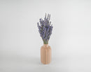 Natural dried Super Blue Royal Velvet lavender bunch in a beige vase, wholesale bulk arrangement.