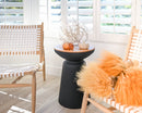 Dried natural baby tumbleweeds in bulk arranged with seasonal decor on black pedestal table in bright room.