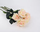 A spray of artificial roses with cream pink petals and green leaves, featuring multiple stems.