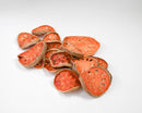 Bulk preserved dried quince slices with natural orange-brown tones in wholesale packaging.