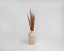 Dried natural ringneck pheasant feathers 16-18 inches tall in a beige ceramic vase, bulk wholesale set.