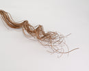 Natural dried curly ting ting branches with twisted, slender stems in bulk wholesale quantity.