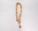Natural tan raffia hank with dried fibers bundled for wholesale bulk use.