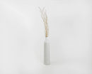 Bundle of dried natural birch branches with gold glitter in a tall gray vase, wholesale bulk set.