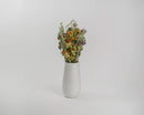 Bulk dried vintage flower bouquet with natural mix of colors in white vase.