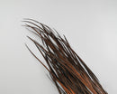 Bulk dried ornamental wild grass bunches in burnt oak color with natural texture.