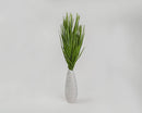 Bunch of dried natural basil green palm leaves in a white vase, wholesale bulk decor.