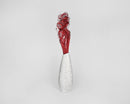Dried natural curly red Ting Ting branches bundled in a tall white vase, wholesale bulk display.