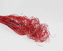 Bulk dried natural curly Ting Ting branches in vibrant red with glittered finish.