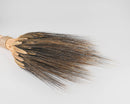 Natural dried wheat stack with dark tips tied in a bundle, wholesale bulk decorative decor.