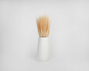 Dried natural wheat stalks arranged in a white ceramic vase, bulk decorative centerpiece.