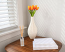 10" soft touch natural tulip bundle in white vase on wooden table with dried reed diffuser and books, wholesale bulk display.
