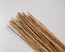 Bundle of natural dried honey bamboo sticks with textured surfaces, ideal for wholesale bulk decor.