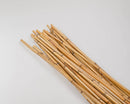 A bundle of dried honey bamboo branches arranged on a white background.