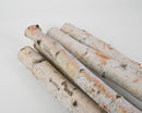 Natural dried white birch poles bundled for wholesale bulk sales, showcasing smooth bark texture.