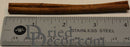 Bulk natural dried cinnamon sticks measuring 6 inches with wood grain texture and rough ends on stainless steel ruler.