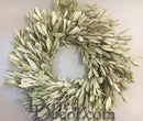 A natural dried Integrifolia wreath displayed against a white background.