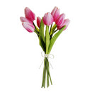 A bouquet of artificial pink tulips tied together with a white ribbon.