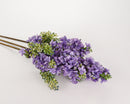 A bundle of artificial lilac spray stems with lavender flowers against a white background.